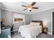 Bedroom with a ceiling fan and a comfortable area featuring a calm and inviting space at 2003 Woodcrest Dr, Winter Park, FL 32792