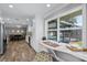 Bright desk area with views of the pool and access to the stylish modern kitchen at 2003 Woodcrest Dr, Winter Park, FL 32792
