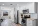 Beautiful kitchen with white cabinetry, stainless steel appliances, and a functional layout at 2003 Woodcrest Dr, Winter Park, FL 32792
