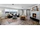 Spacious living room showcasing wood-look floors, a cozy seating area, and natural light at 2003 Woodcrest Dr, Winter Park, FL 32792