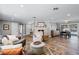 Open-concept living space with a fireplace, dining area, and access to the outdoor pool at 2003 Woodcrest Dr, Winter Park, FL 32792