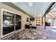 Screened-in patio area with a lounge area, outdoor kitchen, and access to a private pool at 2003 Woodcrest Dr, Winter Park, FL 32792