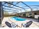 Relax on the pool deck with a view of the refreshing screened-in pool at 2003 Woodcrest Dr, Winter Park, FL 32792