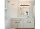 Well-lit bathroom featuring a large vanity and a sleek, updated light fixture above the mirror at 2007 Cornell Pl # 4, Port Orange, FL 32128