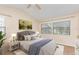 Bright bedroom featuring vaulted ceilings, a decorative painting, and natural light from the large windows at 2007 Cornell Pl # 4, Port Orange, FL 32128