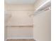 Spacious walk-in closet with ample shelving for organized storage and tile flooring at 2007 Cornell Pl # 4, Port Orange, FL 32128