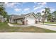 Charming single-story home features a two-car garage, well-manicured lawn, and mature landscaping at 2007 Cornell Pl # 4, Port Orange, FL 32128