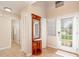 Welcoming foyer with tiled floor, closet, and decorative mirror at 2007 Cornell Pl # 4, Port Orange, FL 32128