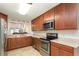 Updated kitchen with stainless steel appliances, granite countertops, and ample cabinet space at 2007 Cornell Pl # 4, Port Orange, FL 32128