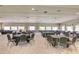 Spacious meeting room with tables and chairs, carpet, and natural light from multiple windows at 2007 Cornell Pl # 4, Port Orange, FL 32128