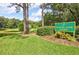 Beautiful view of Overlook Park at Spruce Creek, with lush greenery and serene pond at 2007 Cornell Pl # 4, Port Orange, FL 32128