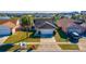 Aerial view of a well-maintained home with a neatly manicured lawn and a two-car garage at 3109 Bear Path, Kissimmee, FL 34746