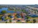 Aerial view showcasing the property's location within a peaceful neighborhood with access to a nearby lake at 3109 Bear Path, Kissimmee, FL 34746