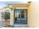 Inviting entryway featuring double glass doors and well-maintained landscaping to welcome visitors at 3109 Bear Path, Kissimmee, FL 34746