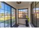 Bright entryway featuring black framed windows and a beautiful view of the lawn at 3109 Bear Path, Kissimmee, FL 34746