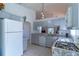 Bright kitchen with modern appliances and a view to the living area at 3109 Bear Path, Kissimmee, FL 34746