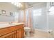 Well-lit bathroom with tub/shower combination and a spacious wood vanity at 3432 Capland Ave, Clermont, FL 34711