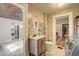 Bathroom with a vanity, toilet, and laundry with washing machine at 3512 Central Ave, Coleman, FL 33521