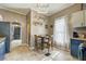 Eat-in kitchen featuring updated appliances and hardwood flooring at 3512 Central Ave, Coleman, FL 33521