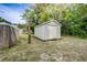 Backyard shed with white siding and a white door at 3512 Central Ave, Coleman, FL 33521