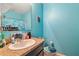 Bright turquoise bathroom with single sink vanity at 3528 Seneca Club Loop # 103 - C, Orlando, FL 32808
