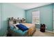 Bedroom with lots of natural light and a storage bed at 3528 Seneca Club Loop # 103 - C, Orlando, FL 32808