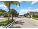 Gated entrance to the community with well-maintained landscaping and secure access at 3528 Seneca Club Loop # 103 - C, Orlando, FL 32808