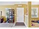 Bright entryway with white door, tiled floor, and view into adjacent carpeted living space at 3528 Seneca Club Loop # 103 - C, Orlando, FL 32808