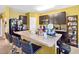 Well-equipped kitchen featuring dark cabinetry, granite countertops, and stainless steel appliances at 3528 Seneca Club Loop # 103 - C, Orlando, FL 32808