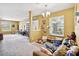 Open living space with carpeted floors and flexible layout that includes the entryway and a bonus room at 3528 Seneca Club Loop # 103 - C, Orlando, FL 32808