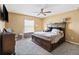 Bedroom with a ceiling fan and a large window at 3528 Seneca Club Loop # 103 - C, Orlando, FL 32808