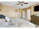 Spacious main bedroom with a ceiling fan and neutral-toned walls for a cozy and inviting atmosphere at 3528 Seneca Club Loop # 103 - C, Orlando, FL 32808