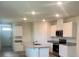 Stylish kitchen with granite countertops, stainless steel appliances, and an island with sink at 3641 Marlberry Way, Sanford, FL 32773
