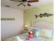 Bright bedroom with a colorful beach theme, including flamingo and fish decor at 4003 San Sebastian Dr # 108, Kissimmee, FL 34741