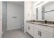 Bathroom features a double vanity, granite countertop, and walk-in shower at 411 St Johns Ln, Kissimmee, FL 34759
