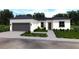 Modern single-story home with a two-car garage, gray trim and coordinated landscaping at 411 St Johns Ln, Kissimmee, FL 34759