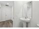 Elegant half bath with pedestal sink and modern fixtures at 4514 Windy Oak Way, St Cloud, FL 34772