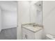Stylish bathroom with a granite countertop vanity, ample lighting, and contemporary finishes at 4514 Windy Oak Way, St Cloud, FL 34772