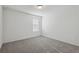 Bedroom with neutral carpet and a window at 4514 Windy Oak Way, St Cloud, FL 34772