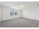 An open bedroom with plush carpet, crisp white walls, and natural light at 4514 Windy Oak Way, St Cloud, FL 34772