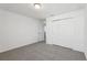 Bright bedroom featuring neutral carpet and a spacious closet at 4514 Windy Oak Way, St Cloud, FL 34772