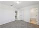 Bright bedroom with ensuite bathroom, plush carpeting and neutral decor offers a cozy retreat at 4514 Windy Oak Way, St Cloud, FL 34772