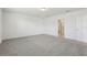 A generously sized carpeted bedroom leading to en-suite bathroom at 4514 Windy Oak Way, St Cloud, FL 34772