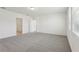 Spacious carpeted bedroom featuring neutral walls and open doorway at 4514 Windy Oak Way, St Cloud, FL 34772