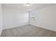 Light and airy carpeted bedroom featuring natural light and neutral color palette at 4514 Windy Oak Way, St Cloud, FL 34772