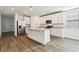 Beautiful kitchen features white cabinets, stainless steel appliances, and a spacious center island at 4514 Windy Oak Way, St Cloud, FL 34772