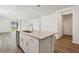 Spacious kitchen island with stainless steel appliances and an open layout to the living area at 4514 Windy Oak Way, St Cloud, FL 34772