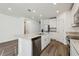 Modern kitchen with a large island, stainless steel appliances, and granite countertops at 4514 Windy Oak Way, St Cloud, FL 34772