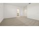 Sunlit room with neutral carpet and white trim, leading to ensuite bathroom at 4673 Cross Prairie Pkwy, St Cloud, FL 34772