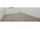 An empty carpeted room at 4673 Cross Prairie Pkwy, St Cloud, FL 34772
